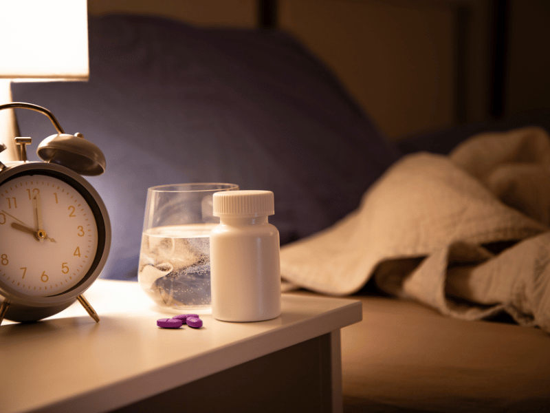 sleeping pills on the bedside table can help to cope with symptoms of insomnia