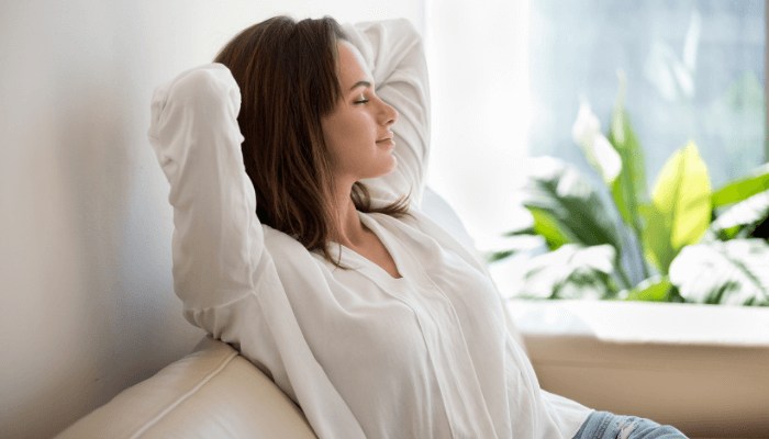 woman relaxing sitting on sofa