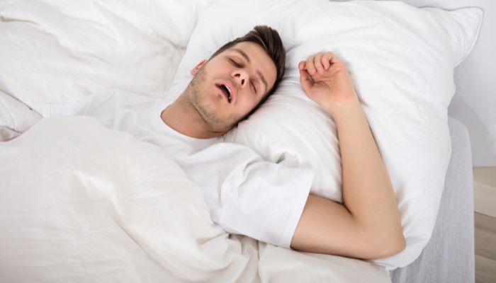 person sleeping with his mouth open