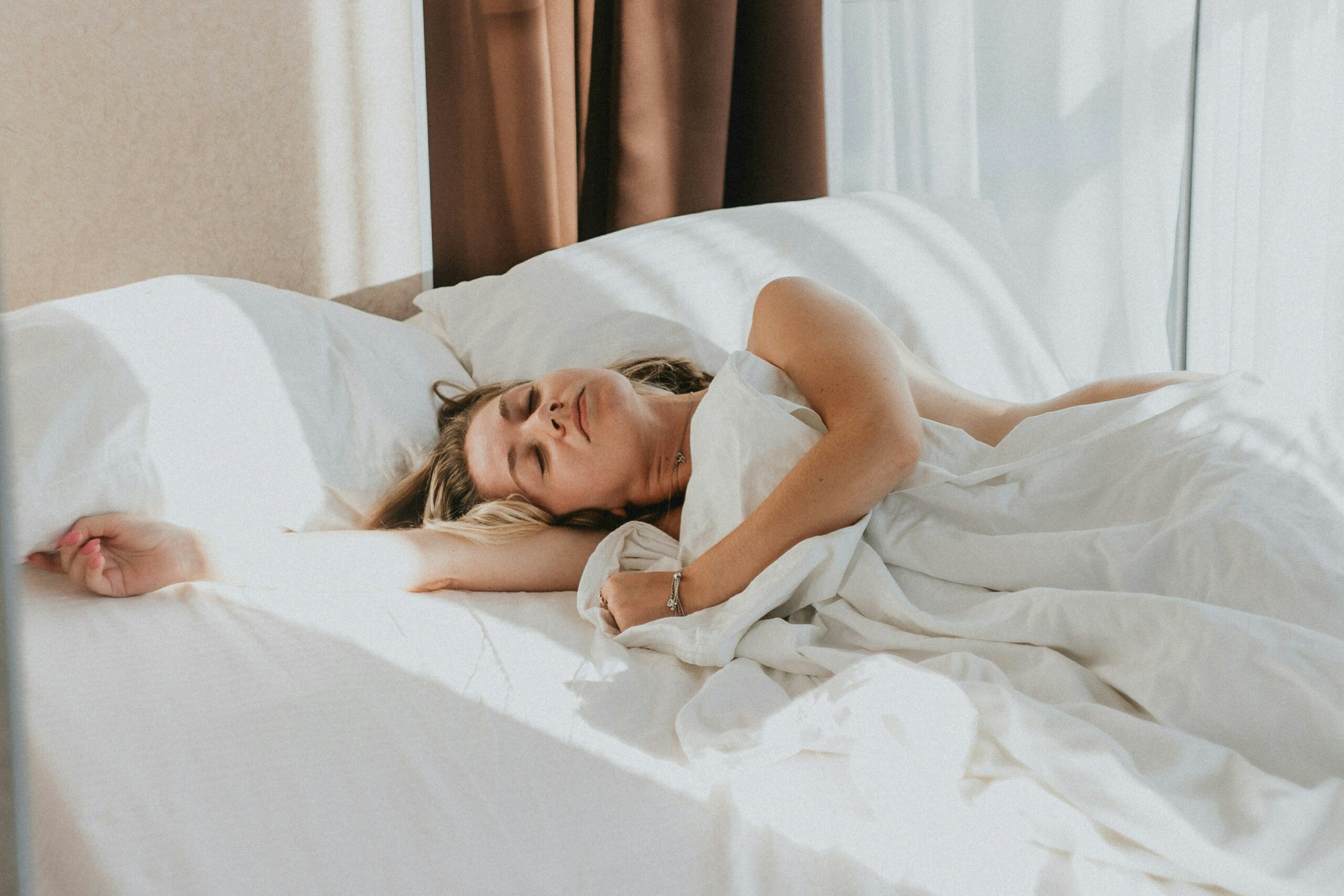 a woman lying in bed