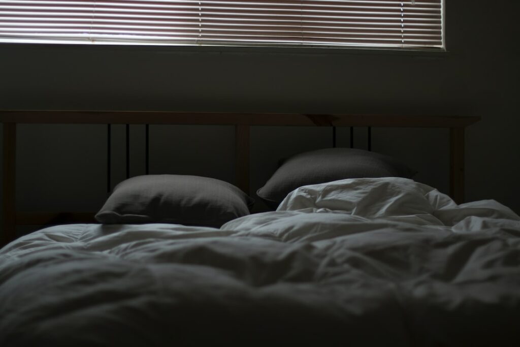 empty white and gray bed set
