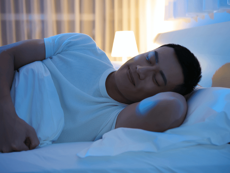 what is light sleep? asian man sleeping on bed with eyes closed