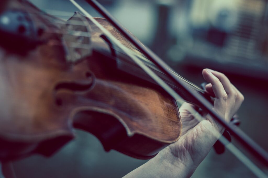 person playing violin close up image