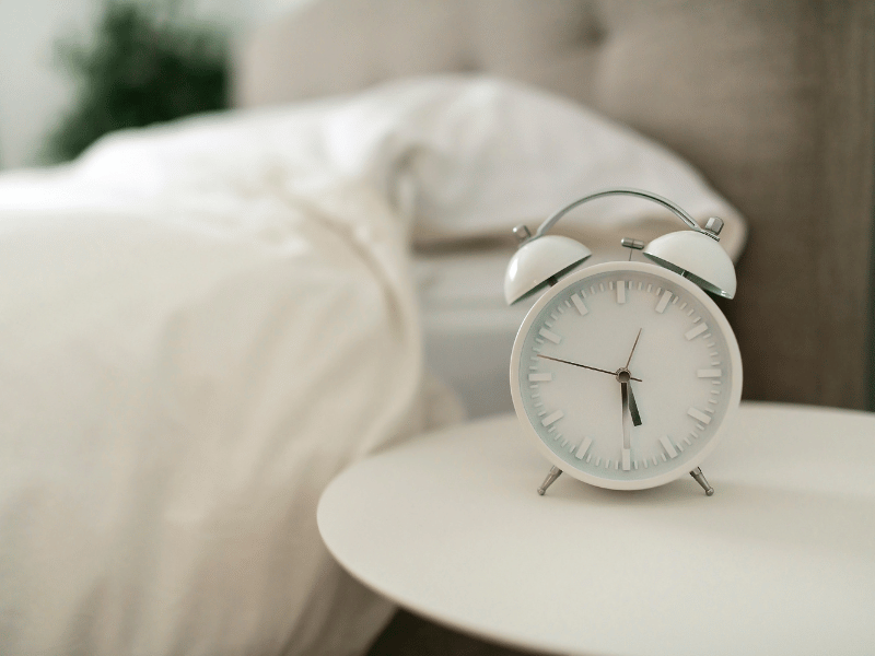 make use of a proper alarm clock by setting a time and not snoozing it often