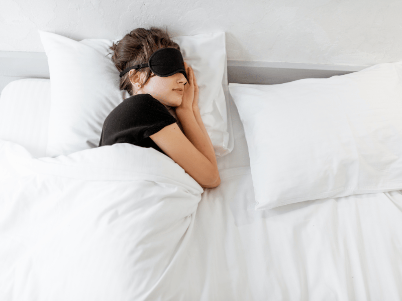 woman sleeping with eye mask on sleep direction importance