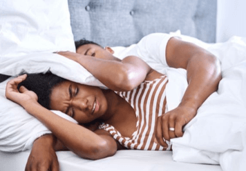 How To Sleep With Someone Who Snores?