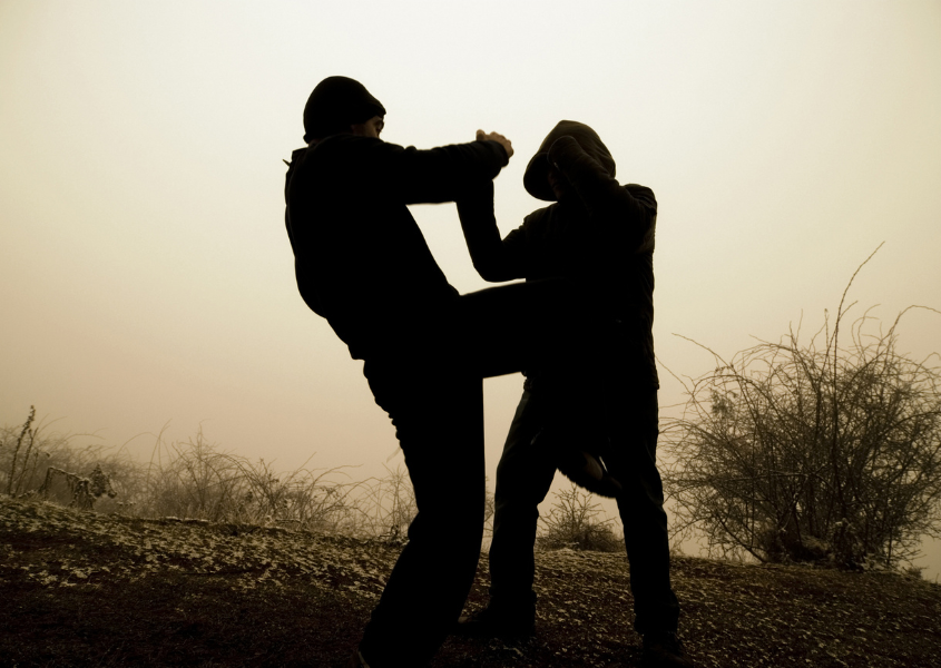 two person fighting each other 