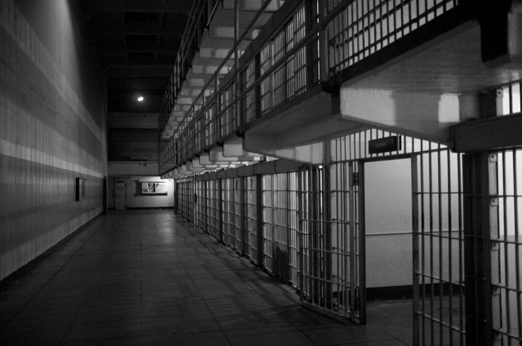 black and white photo of inside of a jail