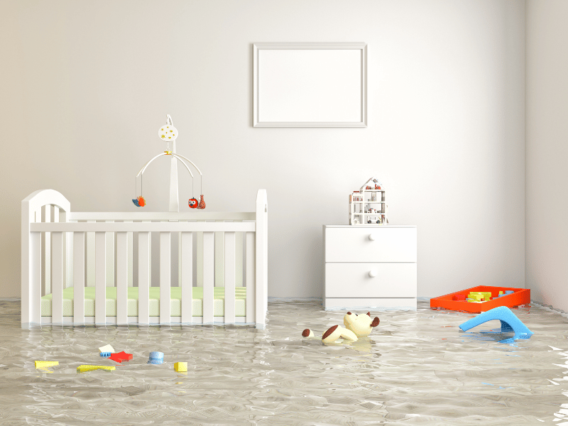 a baby's bedroom and bed being flooded by water