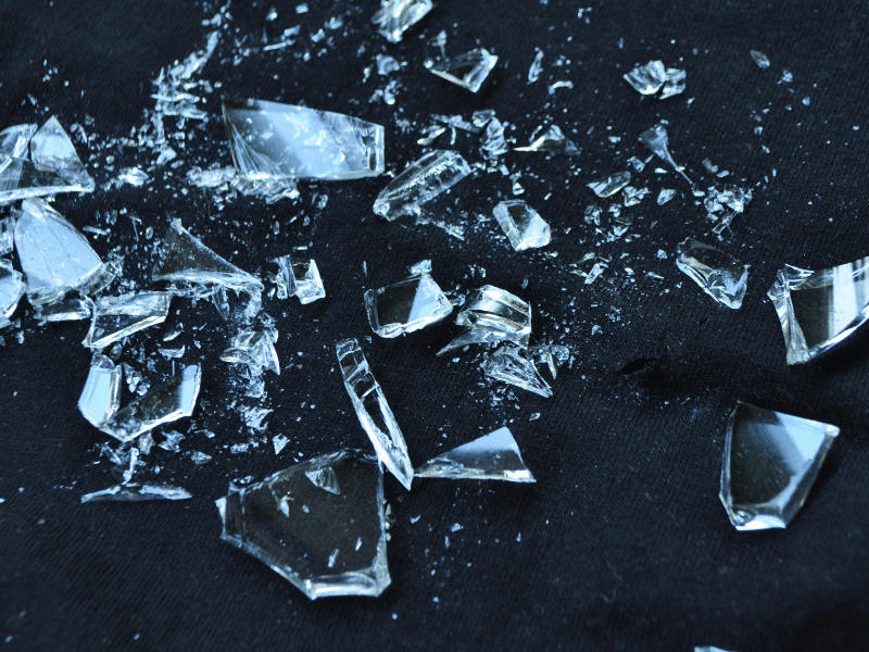 pieces of broken glass on ground