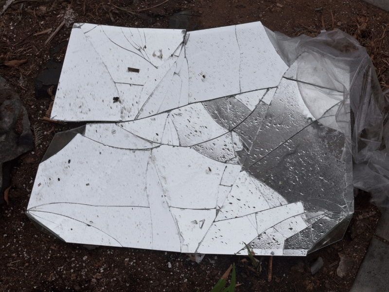 broken glass is a symbol of bad luck or misfortune as part of cultural superstitions