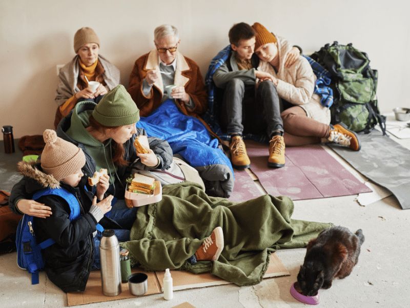 group of refugees taking cover or shelter from war