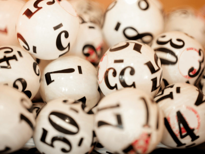 balls with numbers on them indicating lottery numbers